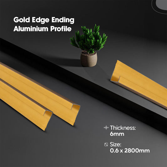 Gold edge ending aluminium profile on a dark surface with a plant for scale.